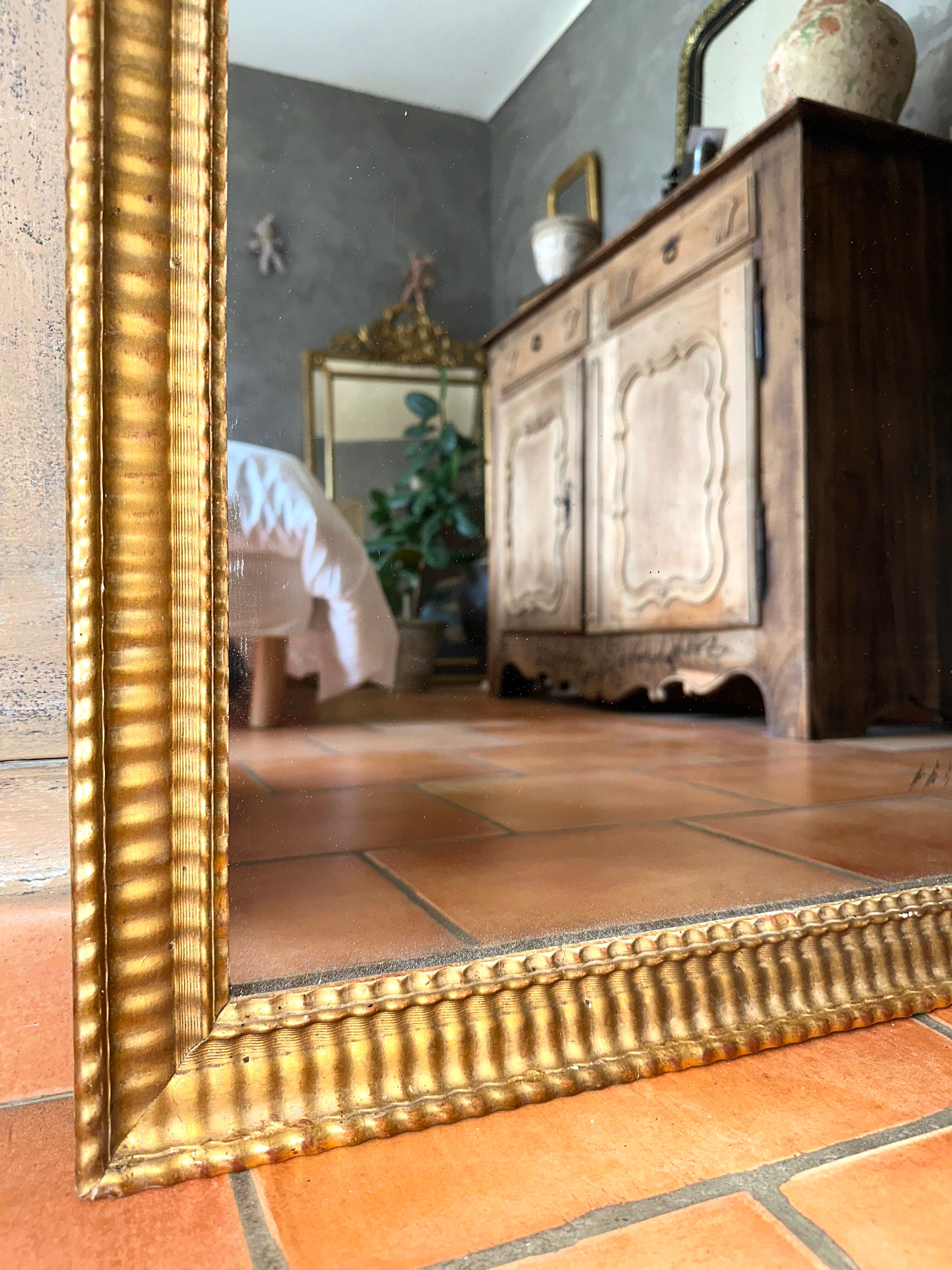 Antique Napoleon III gilded mirror from the 19th century.
