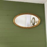 Miroir mural ovale doré