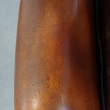 Dark English style sheepskin wingback chair with character and patina