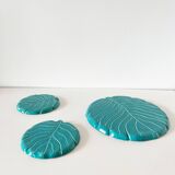 Ceramic trivet and bottle coaster from the 1950s.