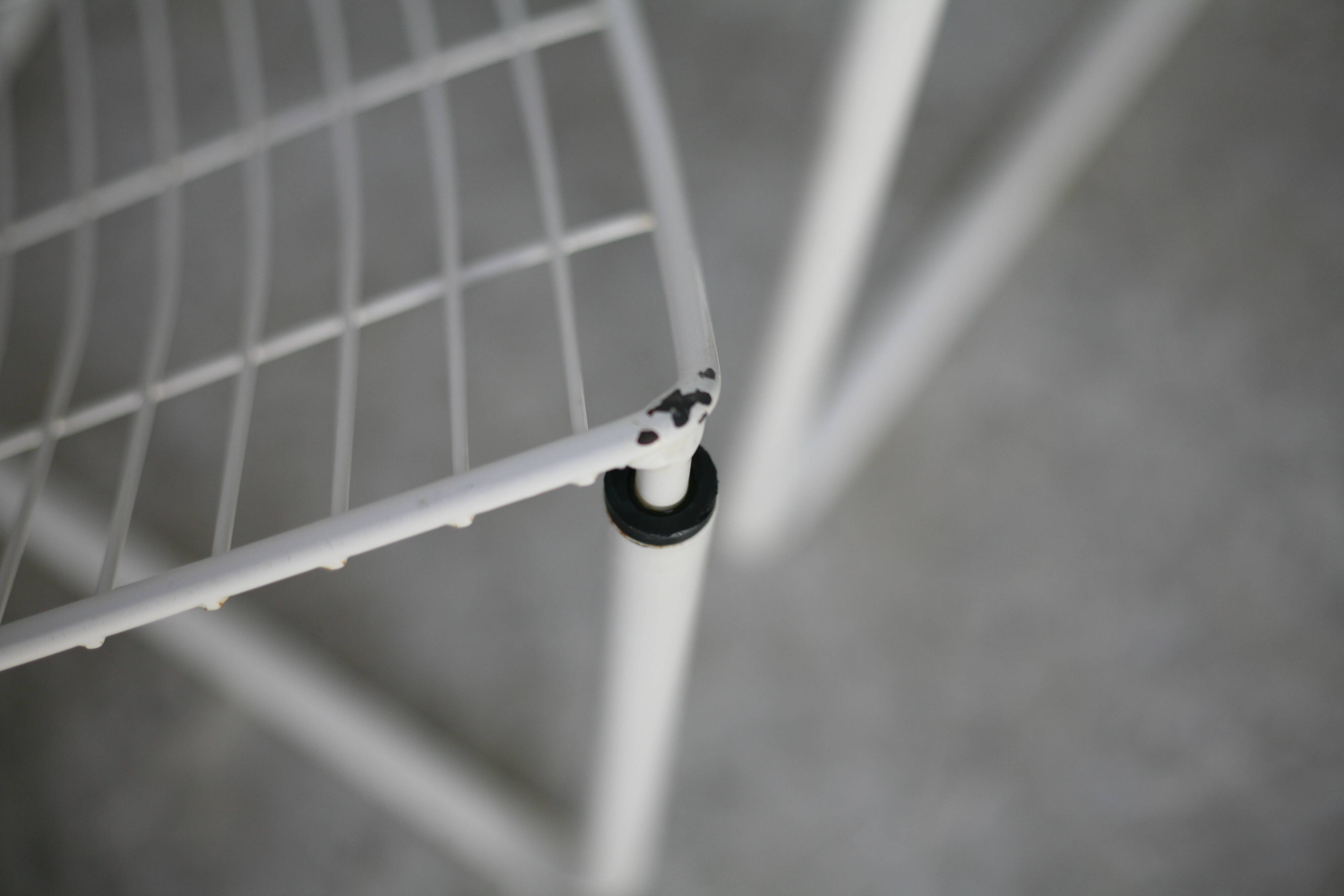 Pair of white lacquered steel rod armchairs. Circa 1985