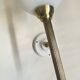 Pair of brass torch wall lights with white opal glass and porcelain