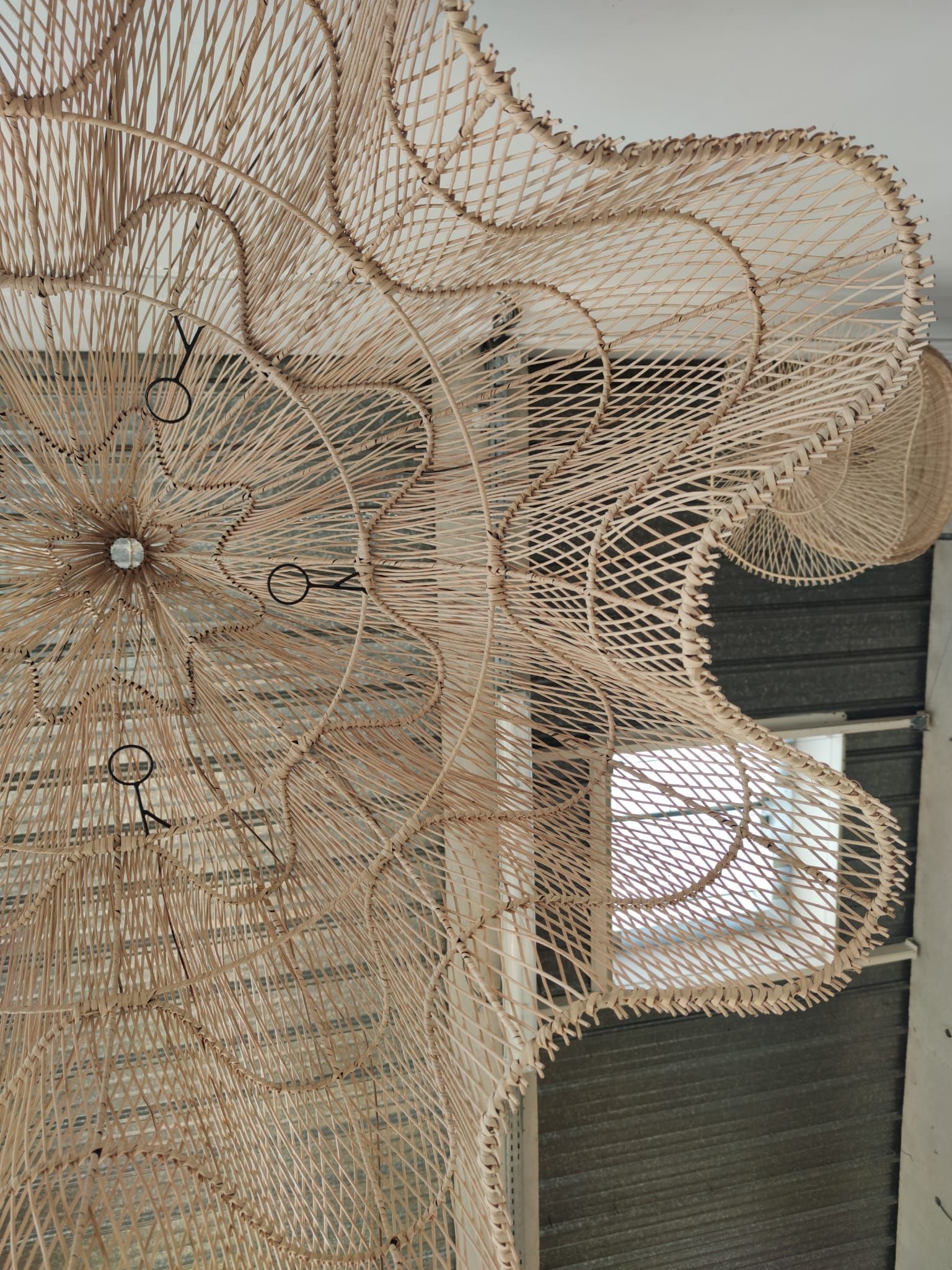 Huge rattan suspension in the shape of a corolla H:1m; D: 1m50