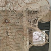 Huge rattan suspension in the shape of a corolla H:1m; D: 1m50