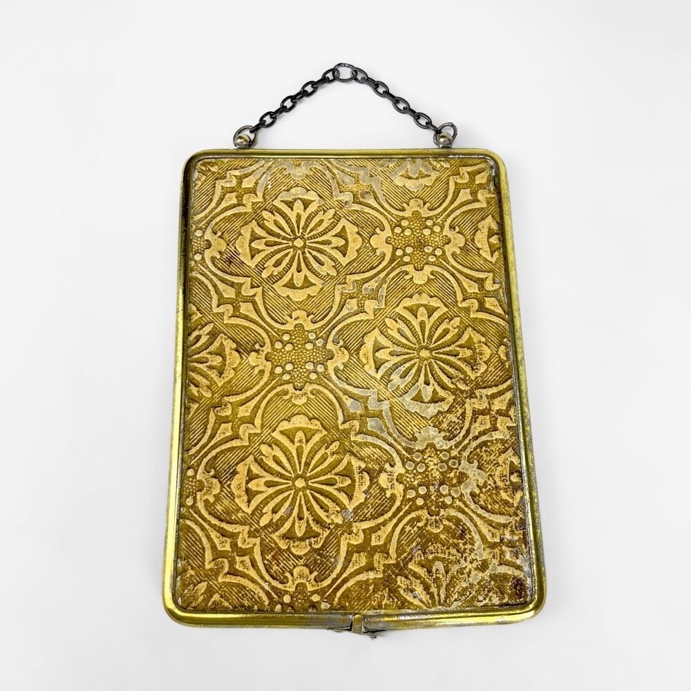 Old barber mirror in brass and beveled glass