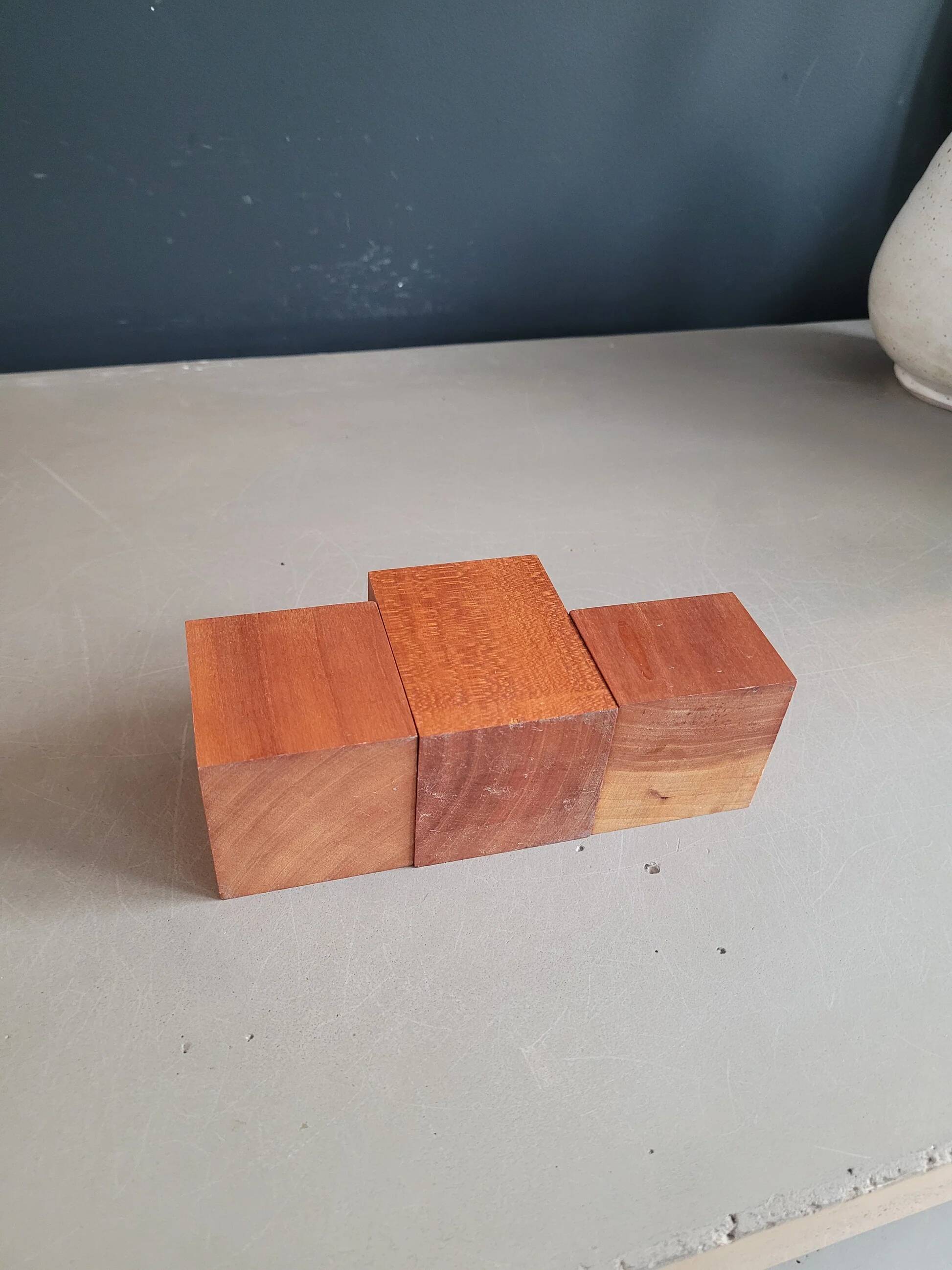 Vintage teak candlestick trio