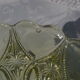 Old small cut on foot in yellow molded glass