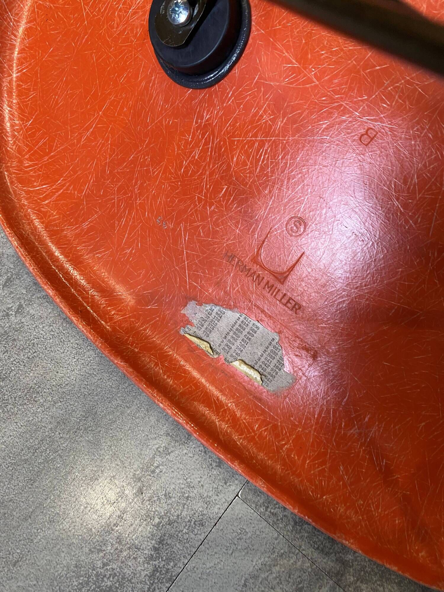 A vintage 70s Eames Herman Miller DSW Fiber Red Orange Dowel Walnut Chair