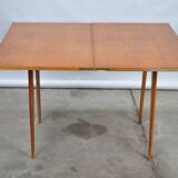 Folding folding table with compass legs