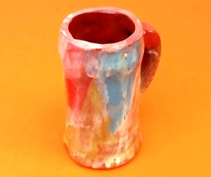 Traditional ceramic mug with a marbled glaze effect.