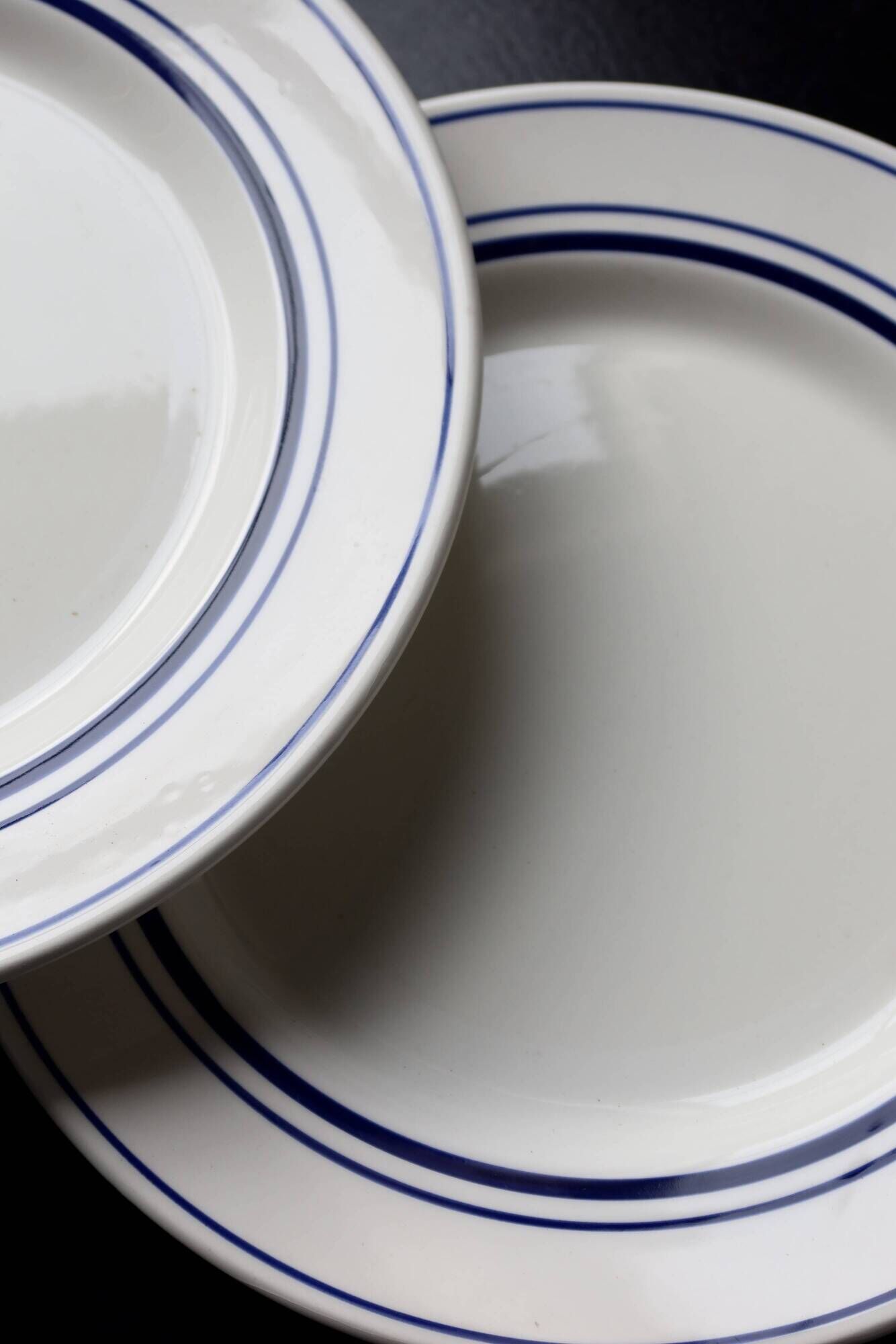4 vintage bistro style flat plates in blue and white porcelain