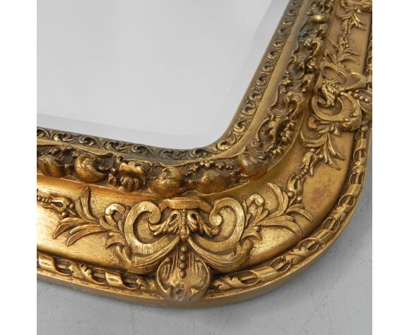 Faceted mirror in gilded frame