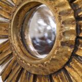 Miroir soleil en bois doré 1950