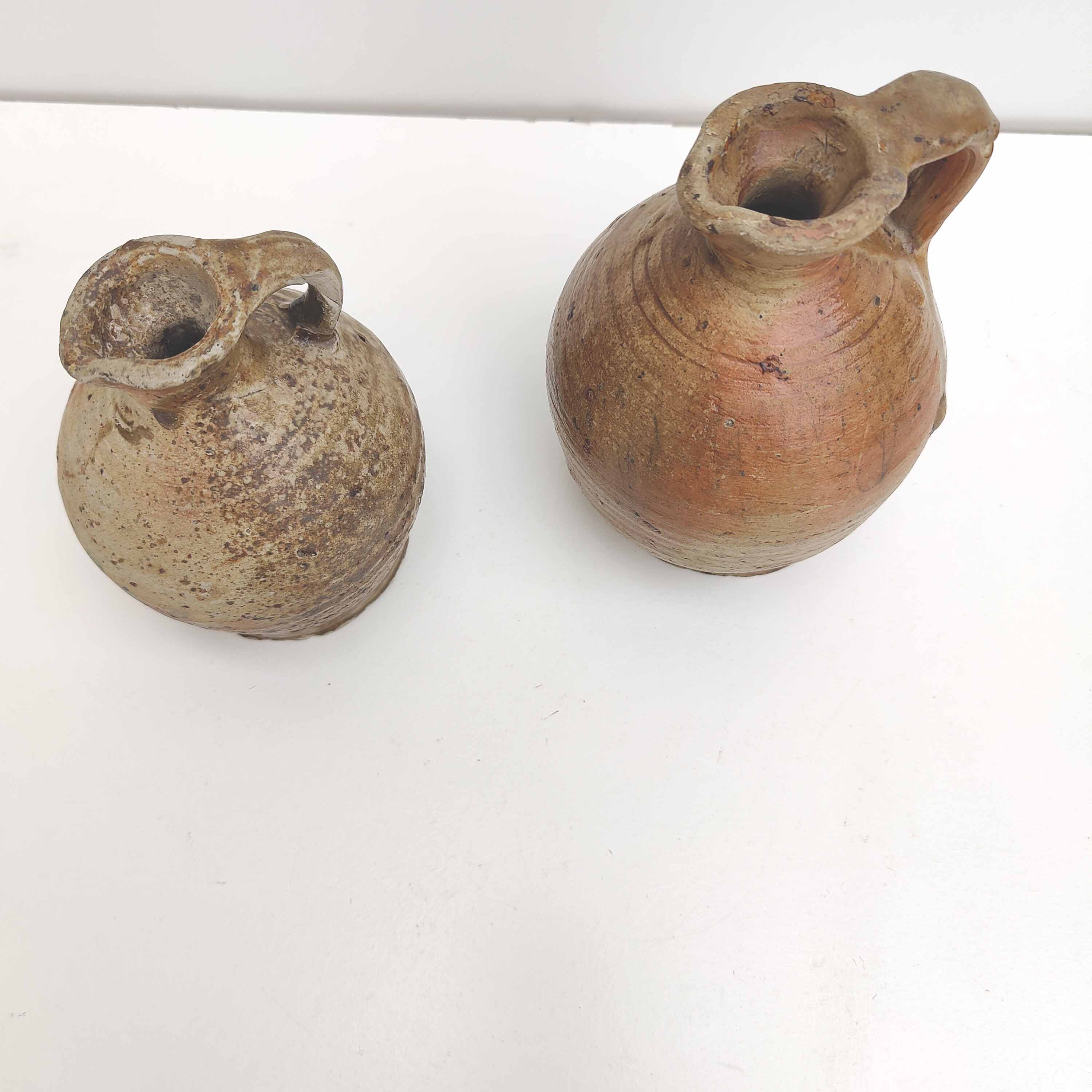 Set of two small sandstone pitchers