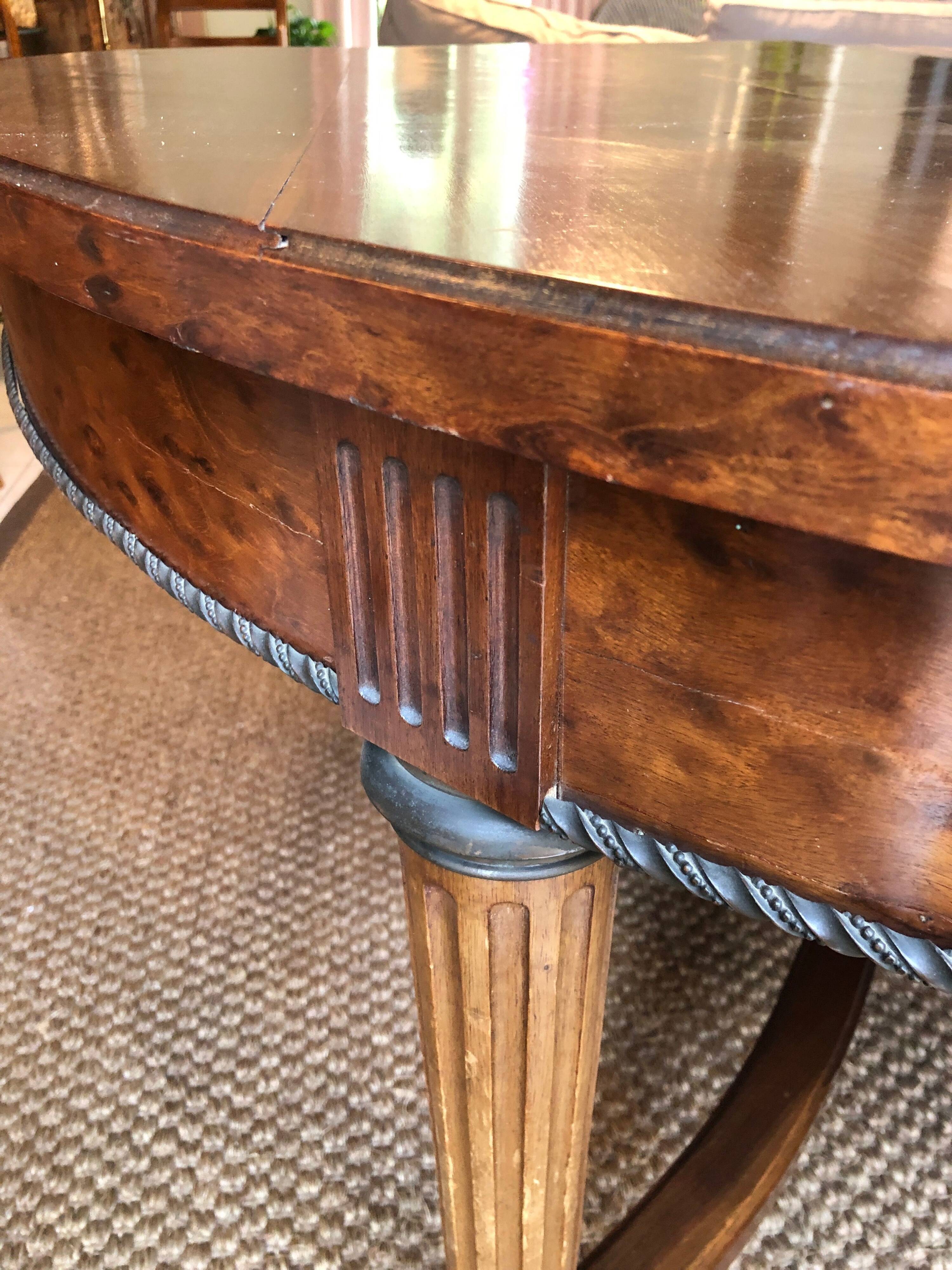 Important central pedestal table in mahogany, brass and bronze that can form a large dining table.
