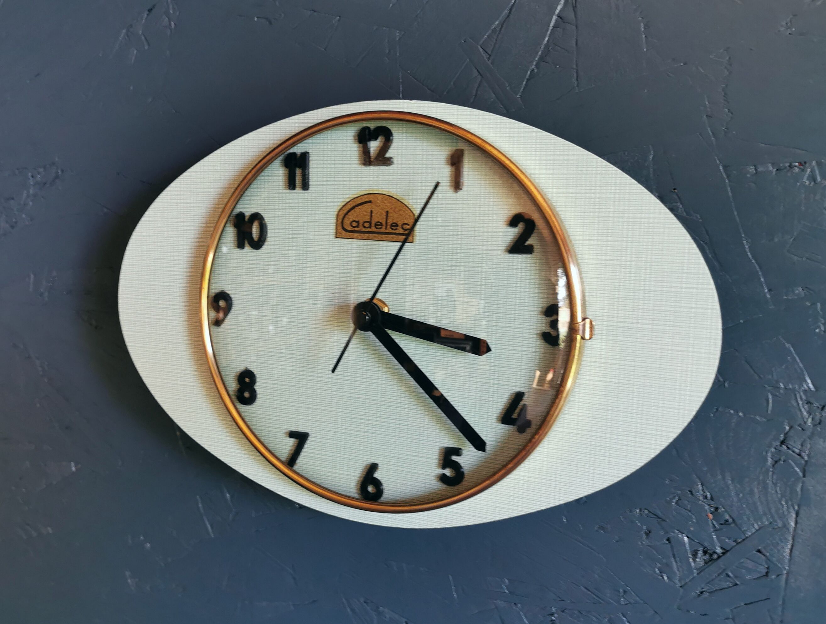 Vintage formica clock oval silent wall clock "Cadelec blue"
