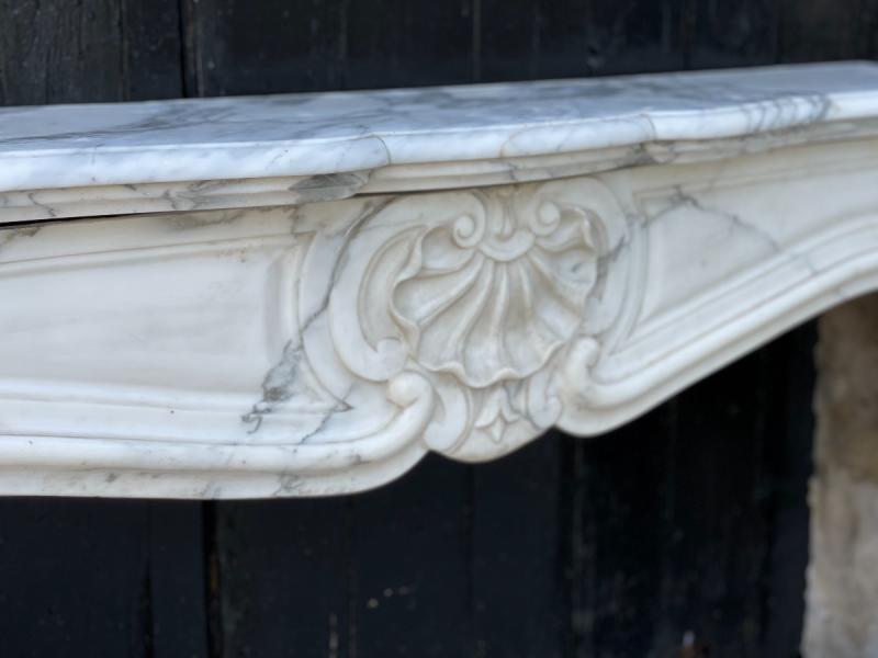 Louis XV style fireplace in white Carrara marble arabescato