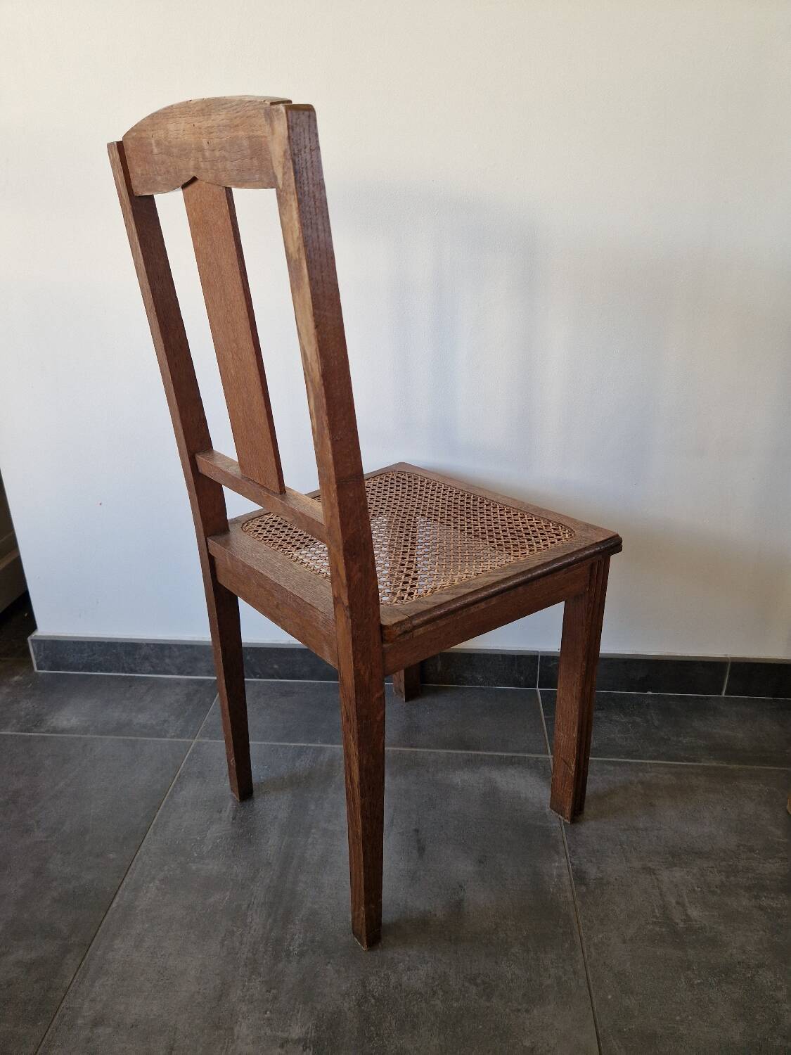 Wooden and cane chair. Carved wooden chair with cane seat.