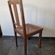Wooden and cane chair. Carved wooden chair with cane seat.