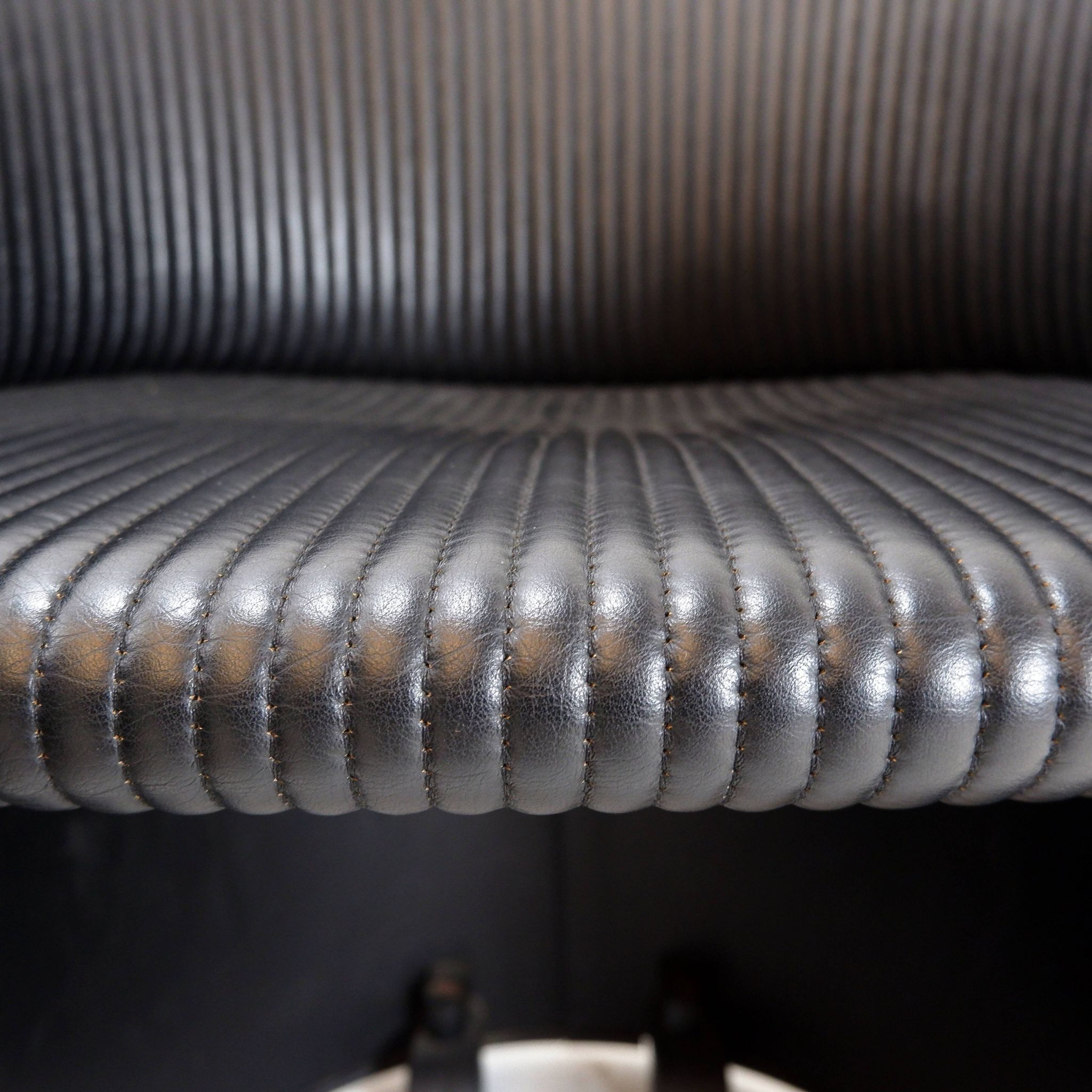 Pair of Artona armchairs in black leather by Afra and Tobia Scarpa for Maxalto.