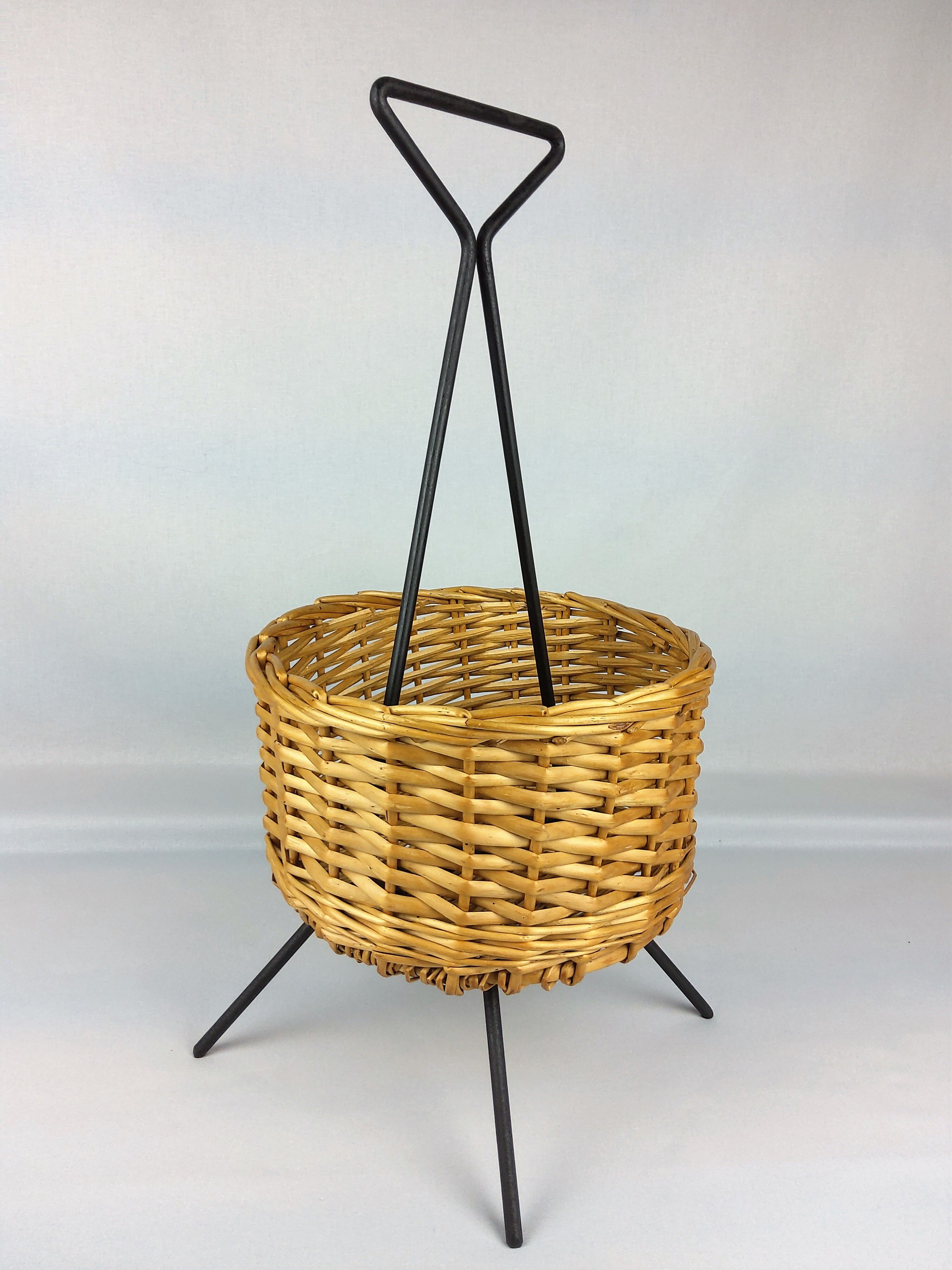 Black metal rattan trash can on 1960