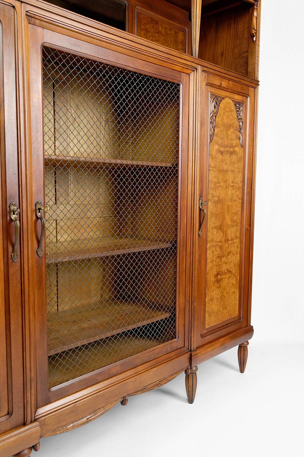 Art Deco showcase bookcase in carved walnut, France, circa 1925