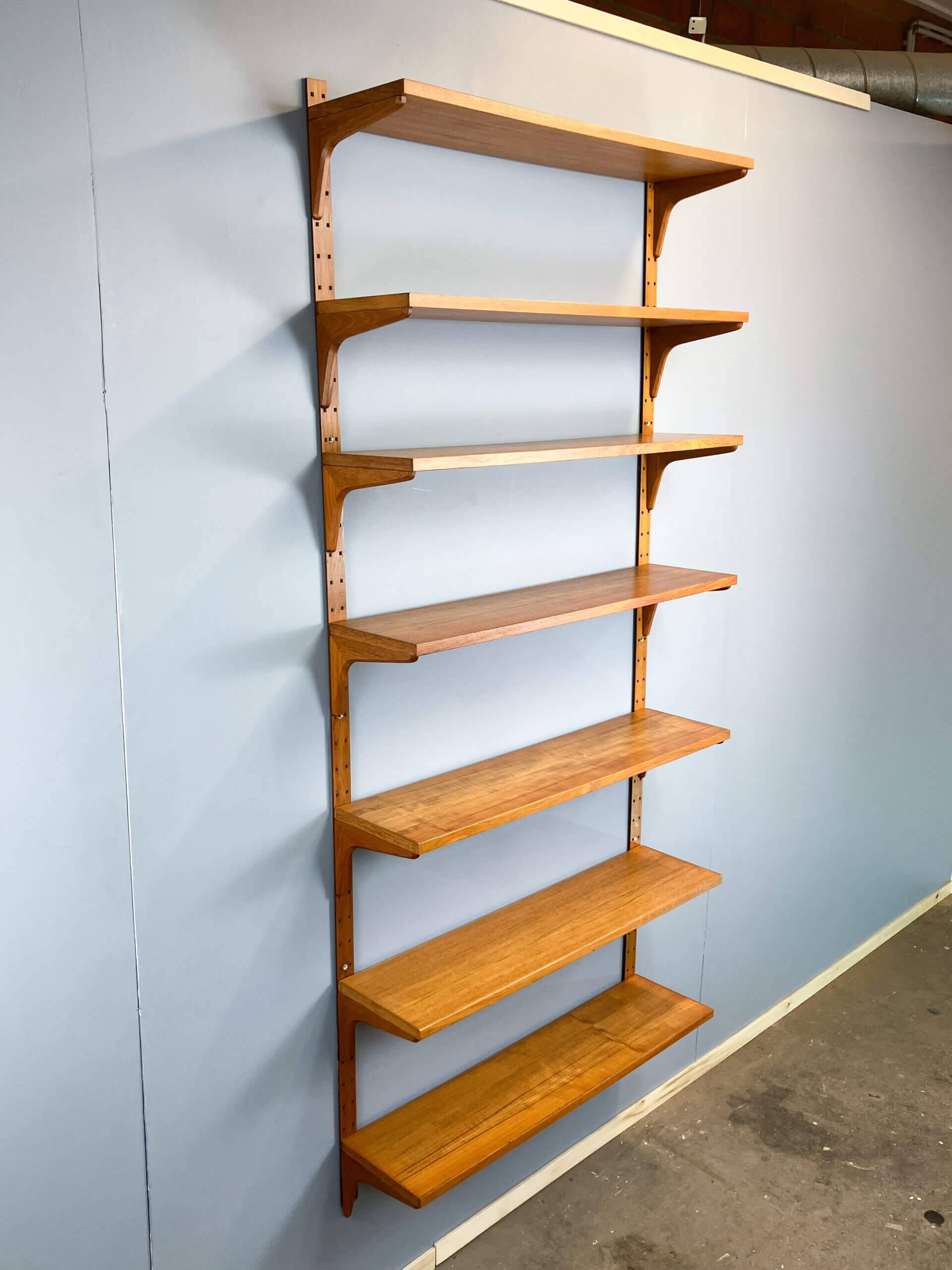Danish wall shelf by Hansen and Guldborg, teak, aluminum rails, 1960s.