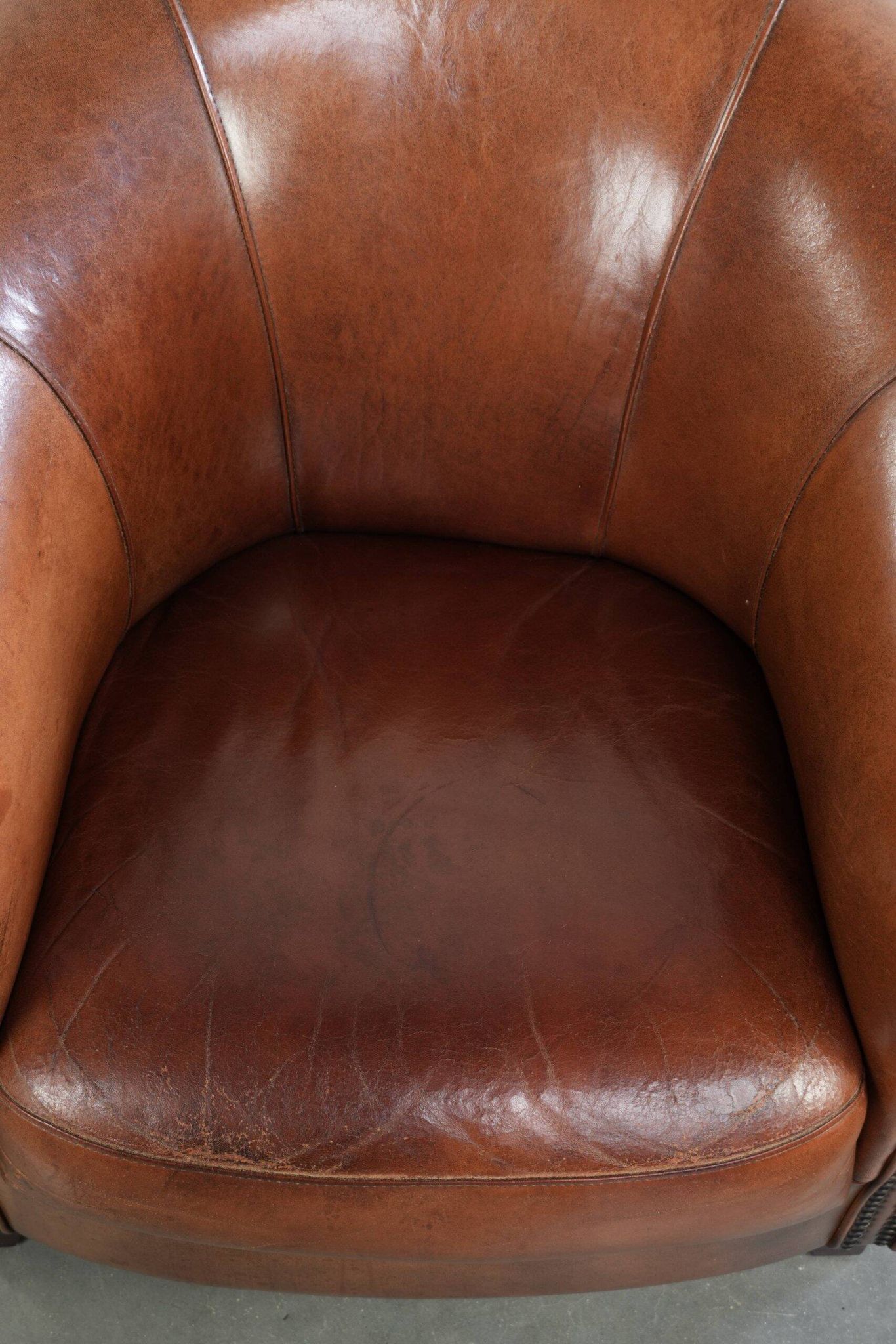 Vintage sheepskin club armchair in English style with deep colours