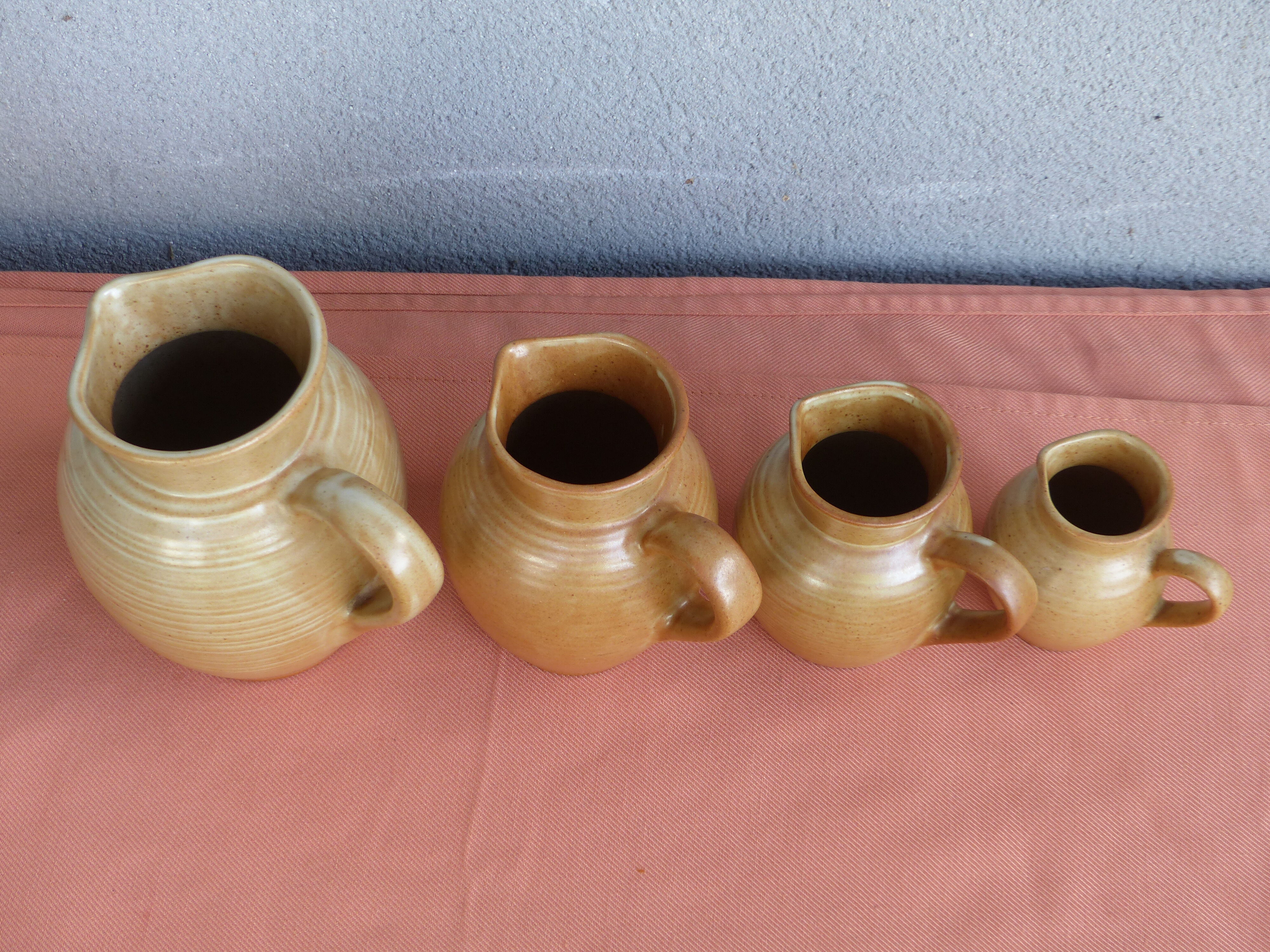 Set of 4 pitchers, CNP, Grès Village France.