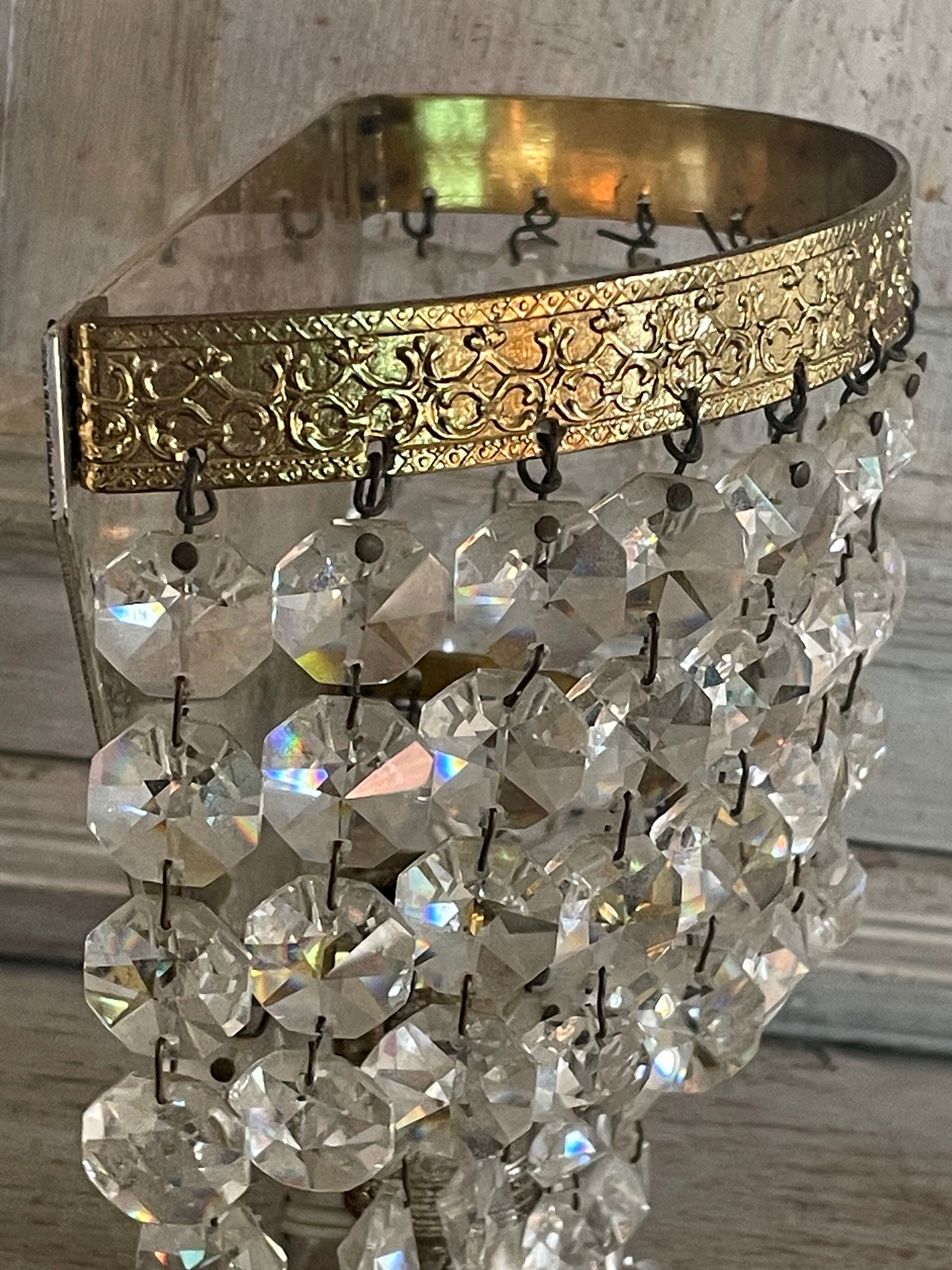 Pair of brass sconces and tassels