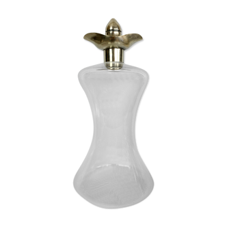 Blown glass carafe with silver frame and cap