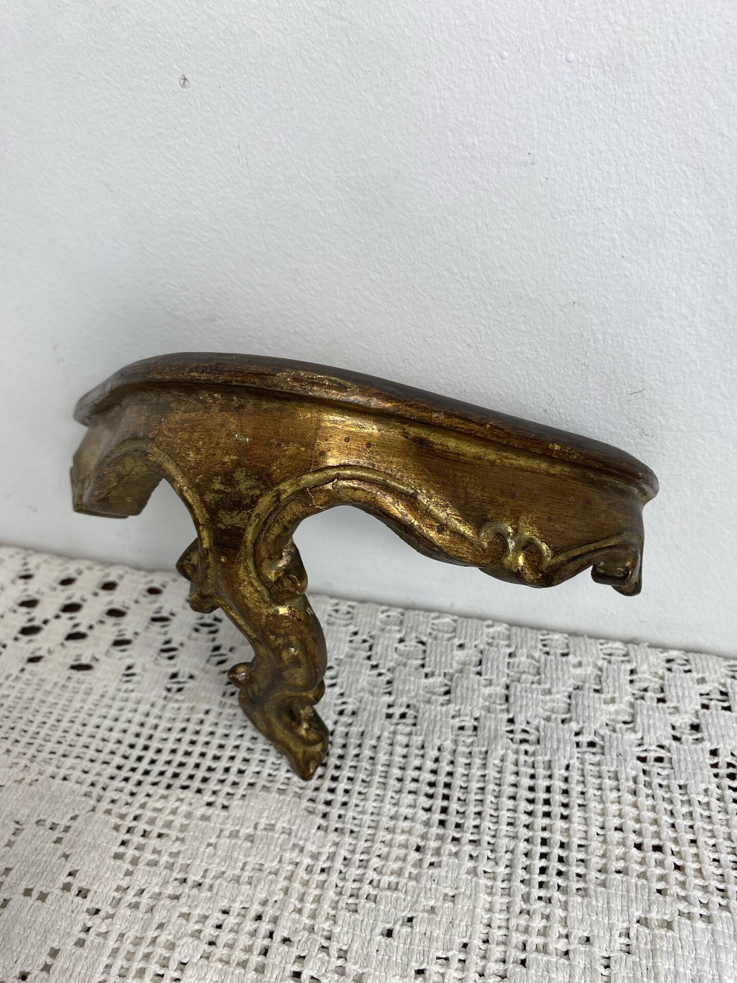 Small baroque-style console in gilded wood.