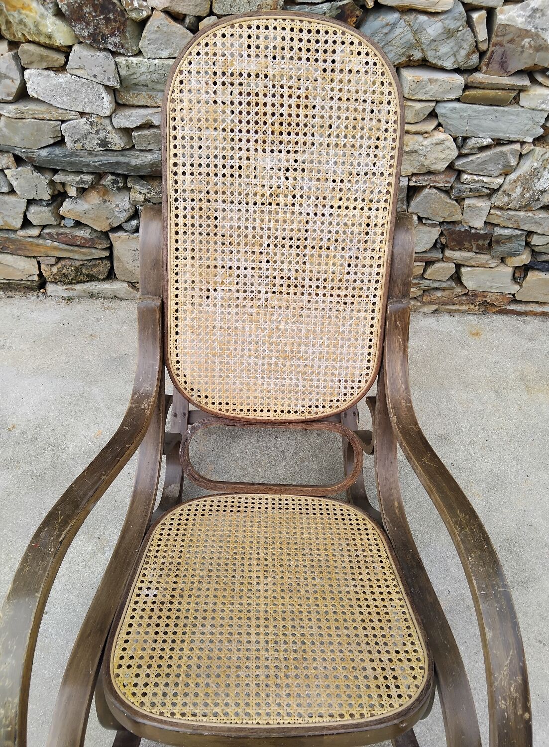 Vintage wooden and cane rocking chair