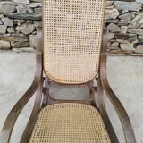 Vintage wooden and cane rocking chair