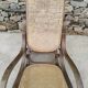 Vintage wooden and cane rocking chair