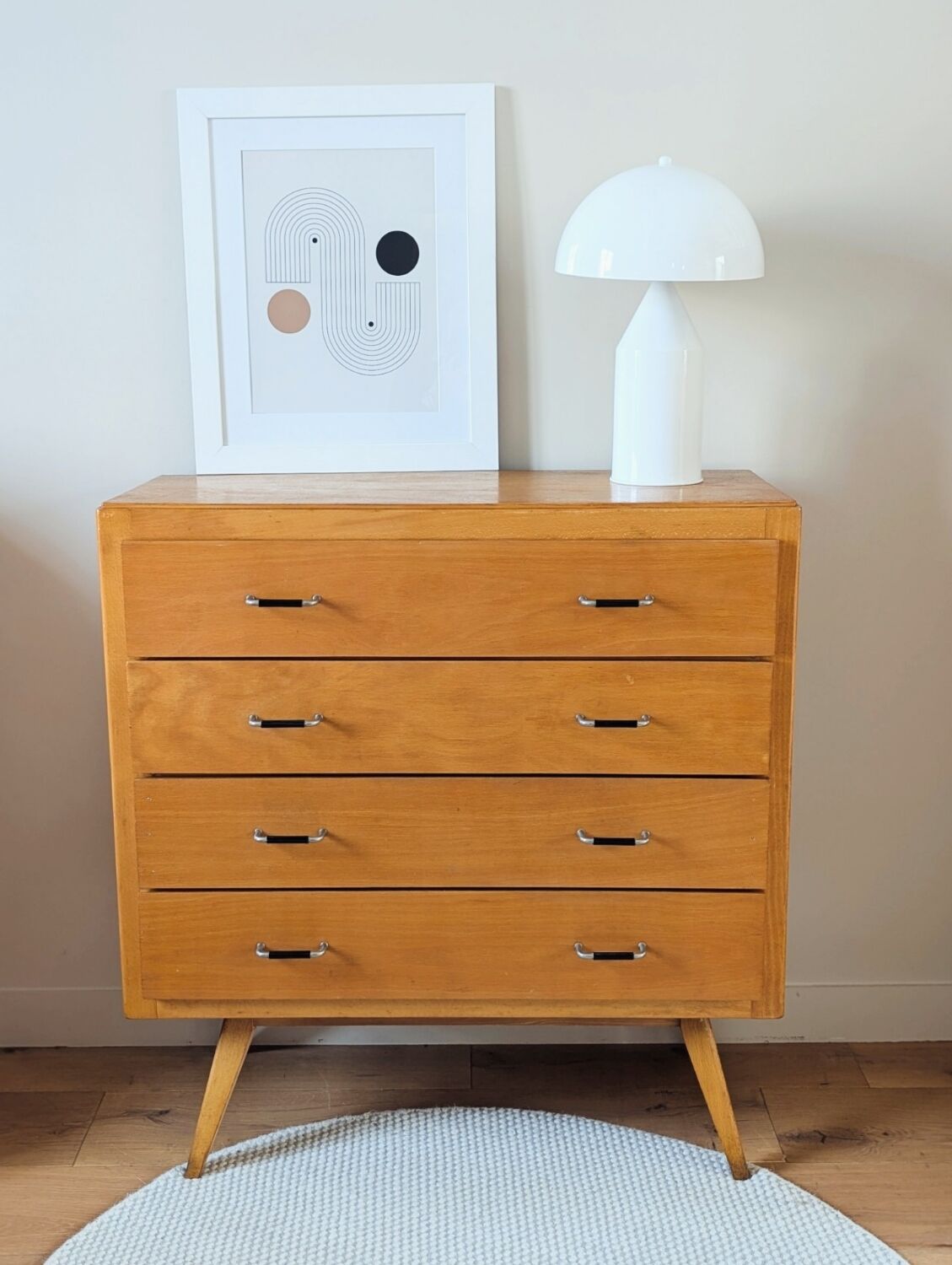 Vintage chest of drawers with tapered legs from the 1960s.