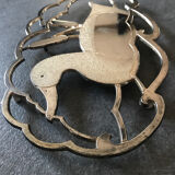 Silver metal duck trivet