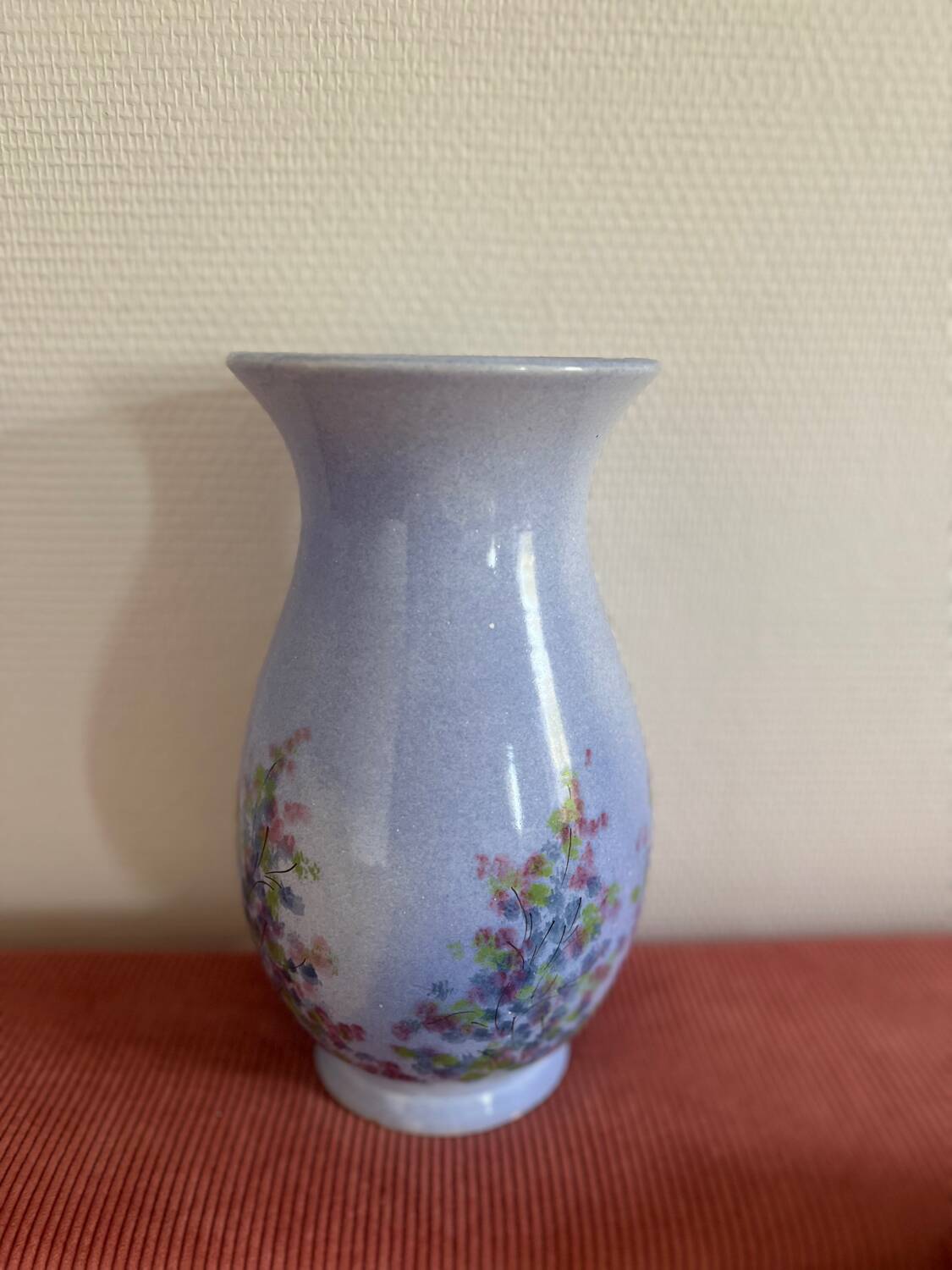 Large blue vase with pastel flowers