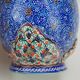 Piriform vase with a flared metal collar enamelled with a polychrome decoration, marked "Amini Iran" on the reverse.