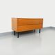 Small vintage Scandinavian sideboard in modernist style made of light oak wood.