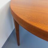 Large vintage Scandinavian round table from the 50s 60s in teak with extensions