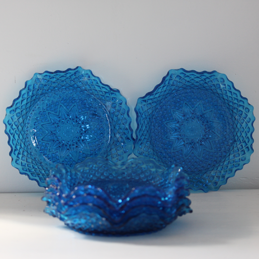 Old table set in blue pressed moulded glass