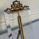 Frame in brass and beveled glass