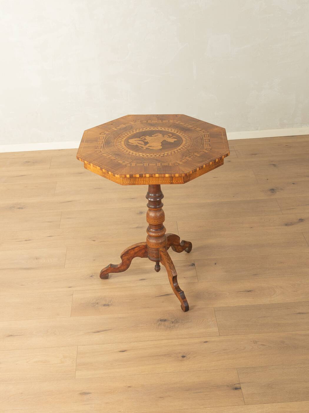 Antique octagonal walnut side table with elaborate inlays, probably Italy, mid-19th century