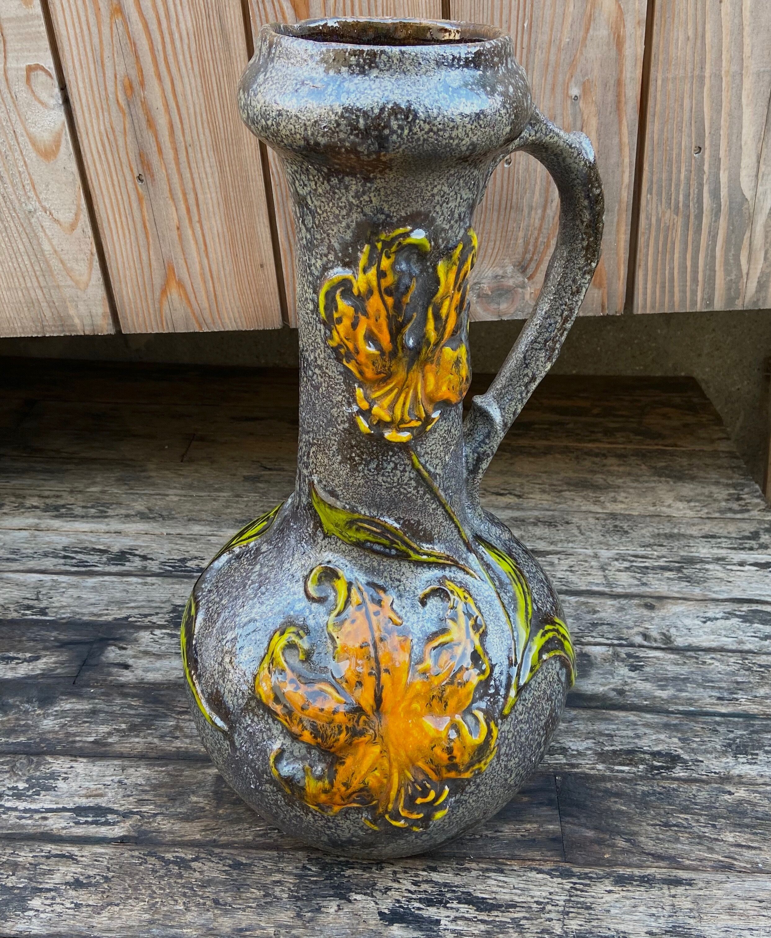 Vintage enamelled ceramic laying vase