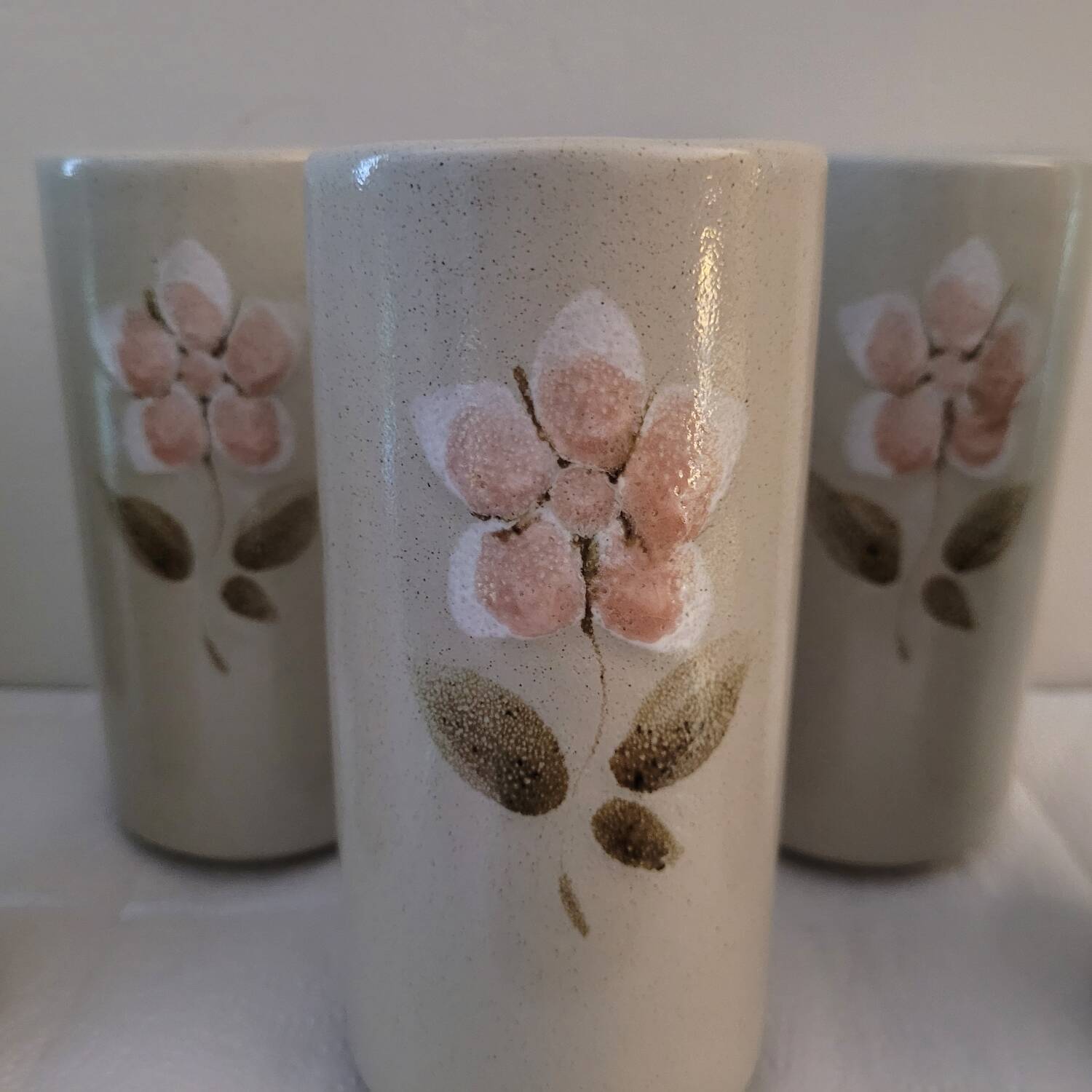Set of 6 stoneware mazagrans with relief floral decoration – 1980s