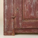 Rustic Parisian cabinet in pine wood with old burgundy paint layers, ca. 18