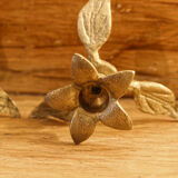 Pair of brass candle holders, flowers