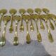 12 pelles à glace métal doré décor filets 14,6cm