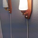 Danish wall lights from the 1970s, made of milky white glass shades, teak wood suspension and brass.